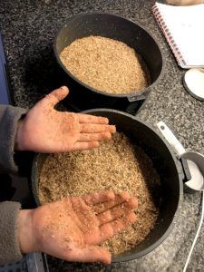Messy hands after pressing the base into the pans