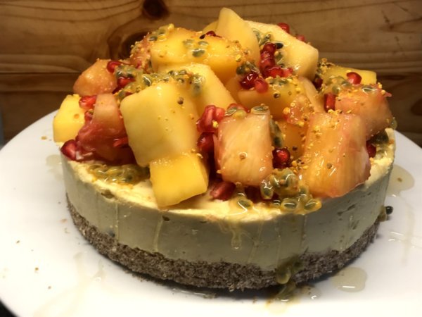 Tropical cheesecake with a ginger base, topped with fresh fruit